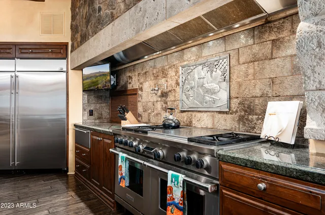 a view of a balcony with table and chairs