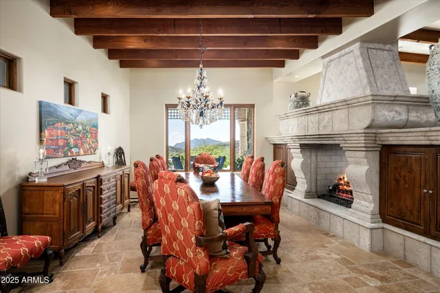 a view of a chairs and table in backyard
