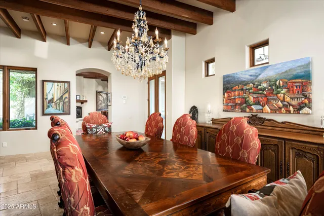 a living room with furniture a fireplace a rug and a window