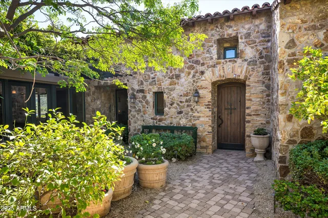 a kitchen with granite countertop a stove and a large window