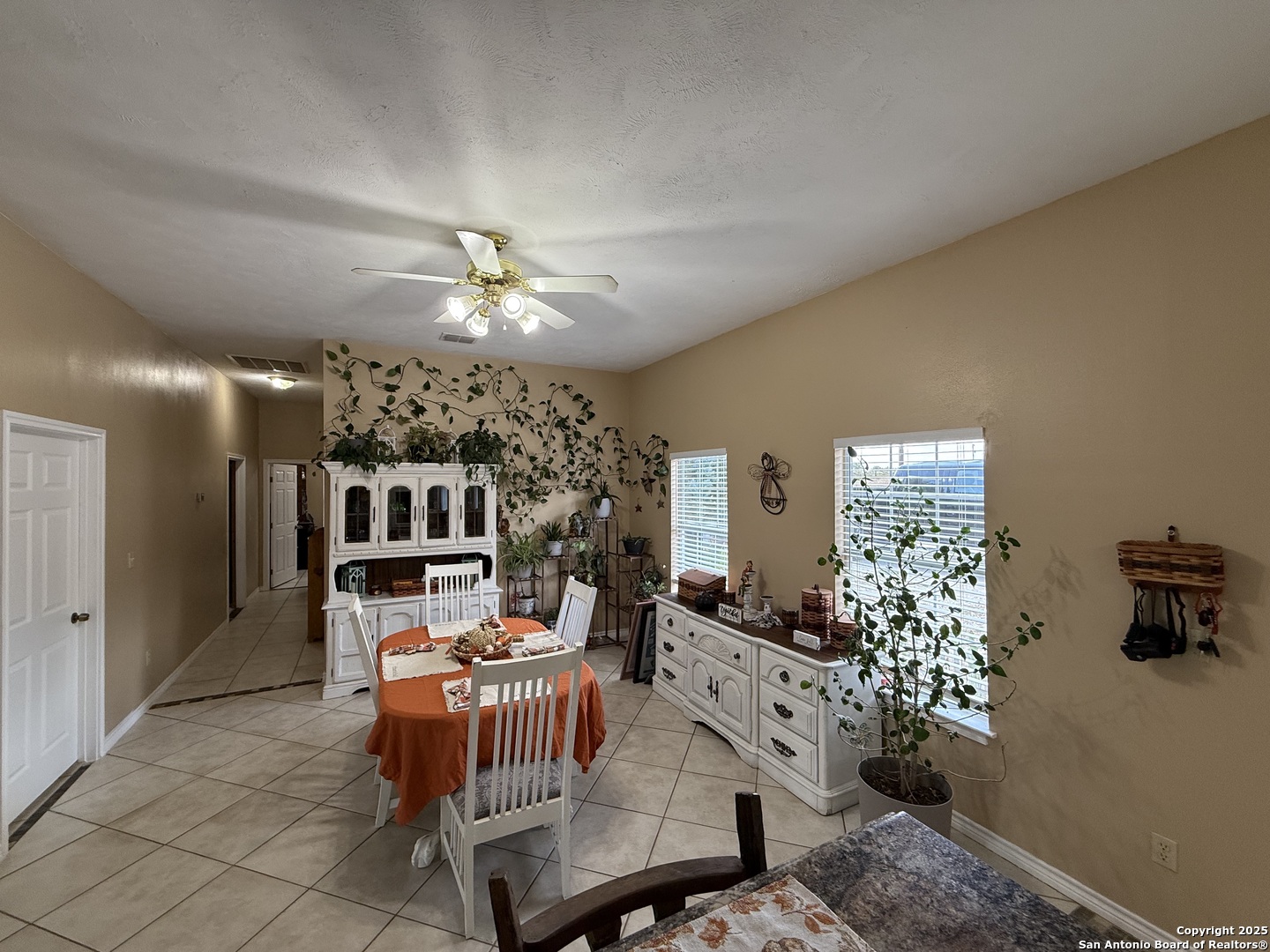 1077 C Road Sutherland Springs, TX 78161 - Photo 11 of 45 a living room with furniture a chandelier and a dining table