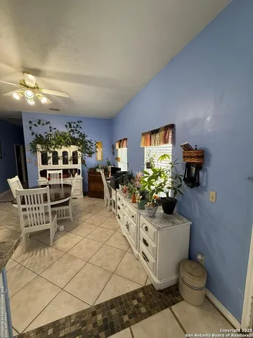 a living room with furniture a rug and a fireplace