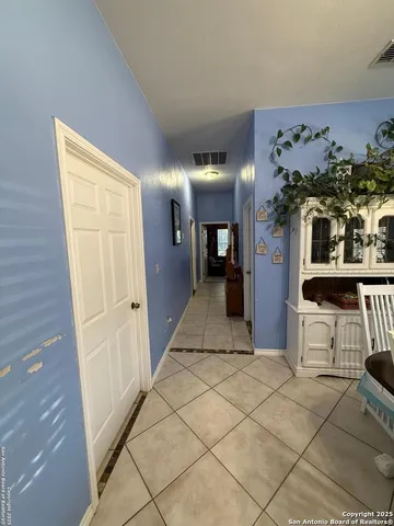 a view of a hallway and dining room