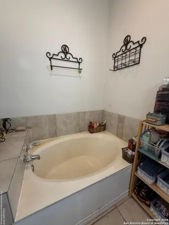 a bathroom with a bathtub and a sink