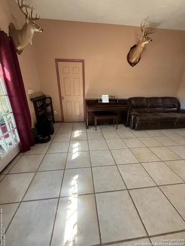 a kitchen with a sink a stove and cabinets