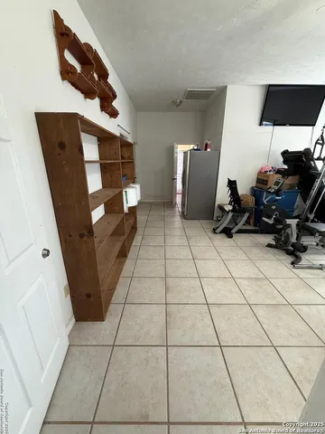 a view of a livingroom with storage and utility