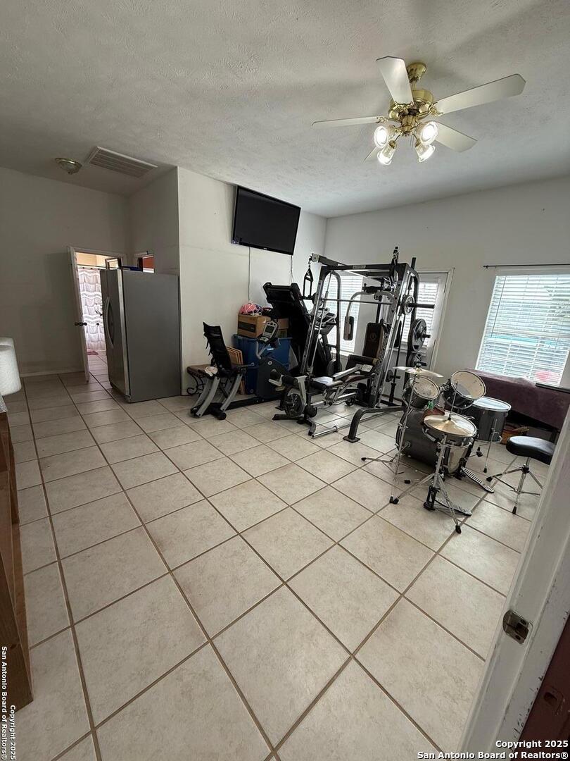 1077 C Road Sutherland Springs, TX 78161 - Photo 26 of 45 a living room with furniture and a chandelier
