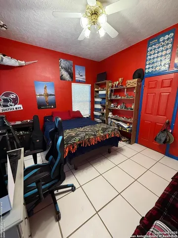 a bedroom with furniture and window