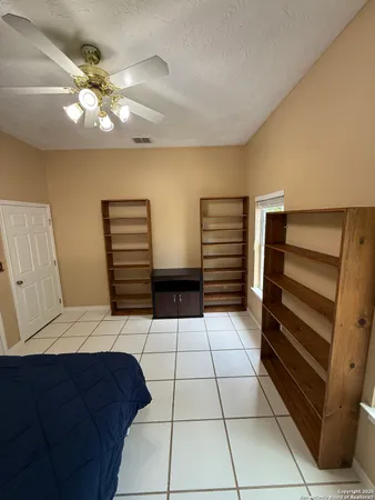 a bedroom with a bed and a walk in closet