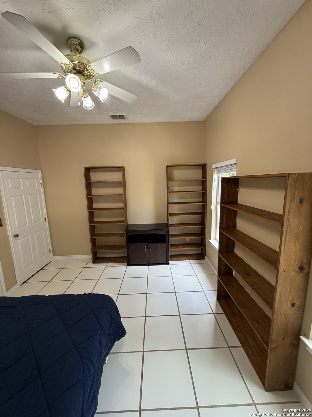 1077 C Road Sutherland Springs, TX 78161 - Photo 29 of 45 a bedroom with a bed and a walk in closet