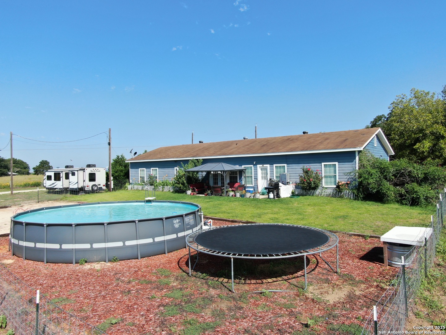 1077 C Road Sutherland Springs, TX 78161 - Photo 3 of 45 a view of a house with a yard porch and sitting area