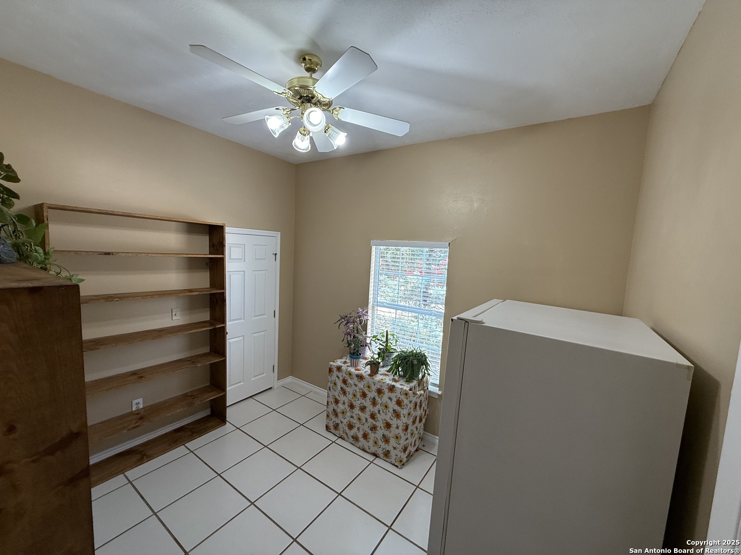 1077 C Road Sutherland Springs, TX 78161 - Photo 32 of 45 a dining room with furniture and a chandelier fan