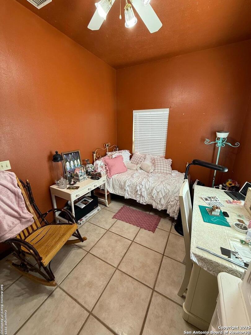 1077 C Road Sutherland Springs, TX 78161 - Photo 40 of 45 a bedroom with a bed and a window