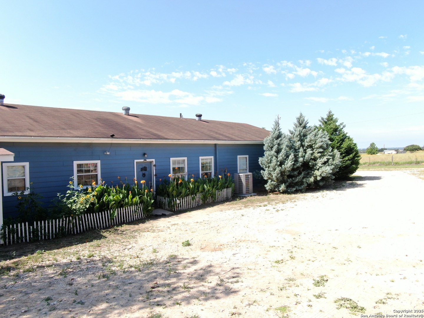 1077 C Road Sutherland Springs, TX 78161 - Photo 43 of 45 a view of a brick house with a yard