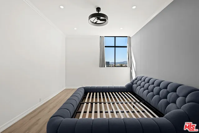 a view of bedroom with furniture and window