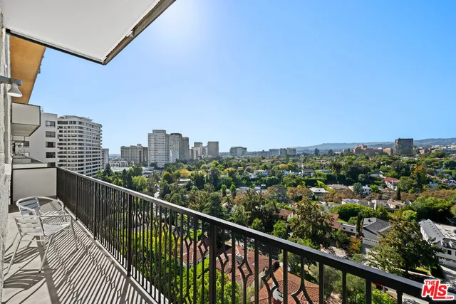 a view of a balcony with city view