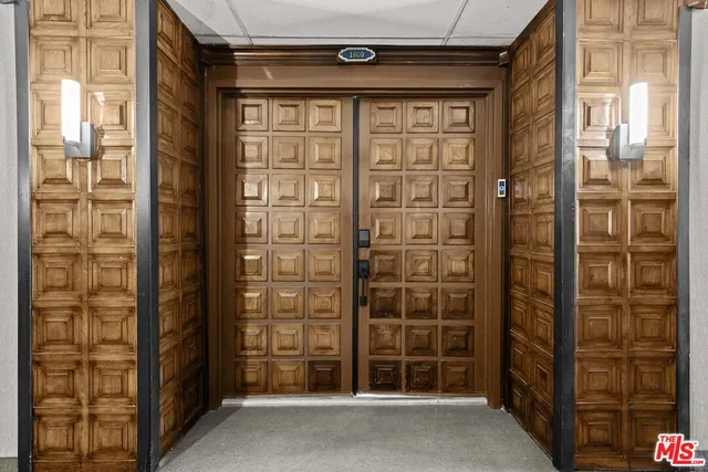 a front view of a building with garden