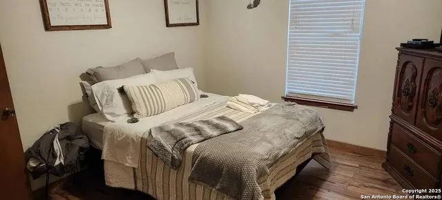 a bedroom with a bed and a table
