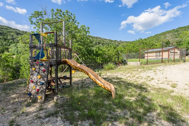 a view of a building in the middle of a yard