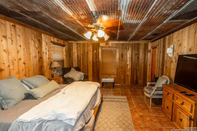 a living room with furniture a rug and a chandelier