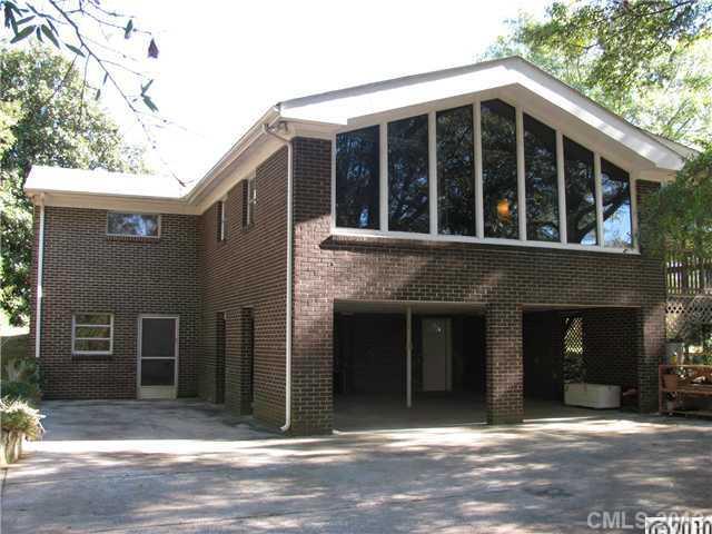 3902 Watson Church Road Monroe, NC 28110 - Photo 1 of 13 a view of a house with a window and a tree