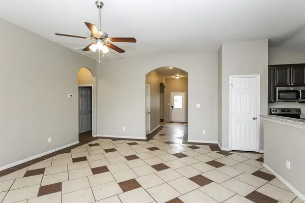 a view of a hallway with a chandelier