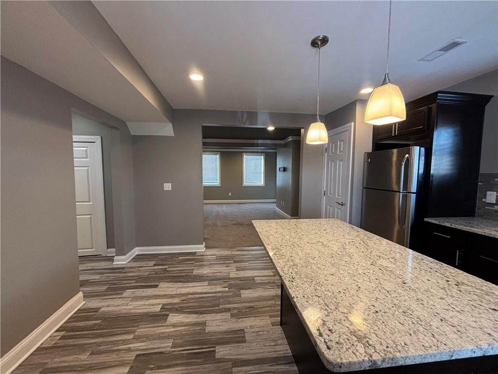 1312 Market Street, Unit 1 Beaver, PA 15009 - Photo 6 of 17 a bedroom with a bed and a chandelier