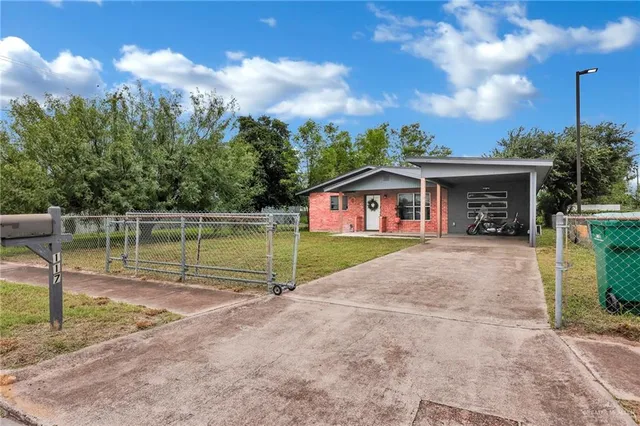 a view of house with outdoor space and swimming pool