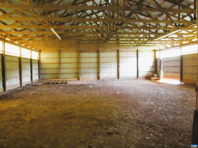 a view of an empty room with a fireplace