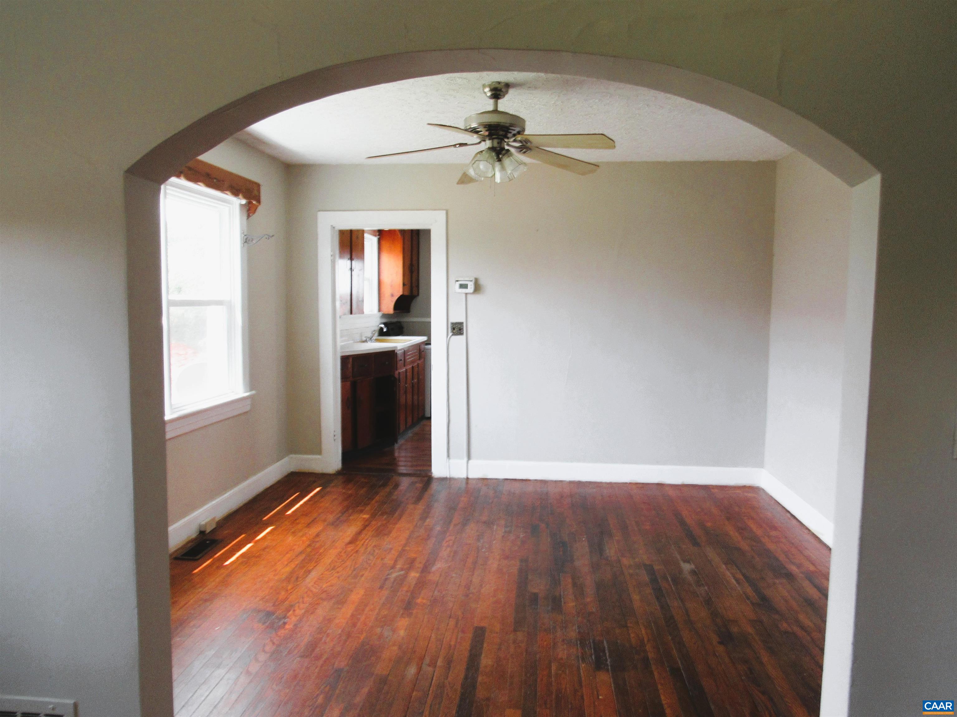 1358 South Coolwell Road Madison Heights, VA 24572 - Photo 9 of 27 wooden floor in an empty room with a window