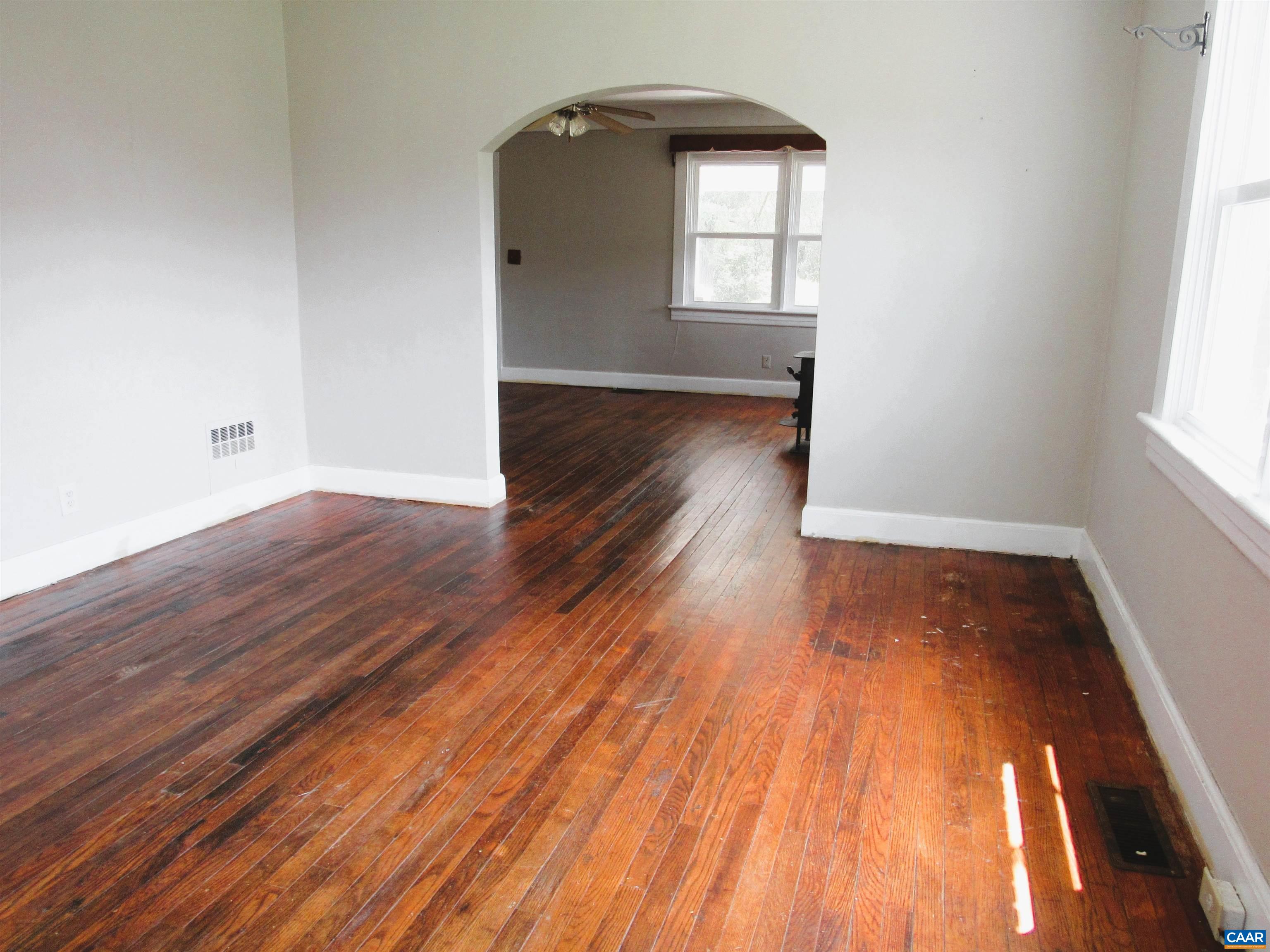 1358 South Coolwell Road Madison Heights, VA 24572 - Photo 10 of 27 an empty room with wooden floor and windows