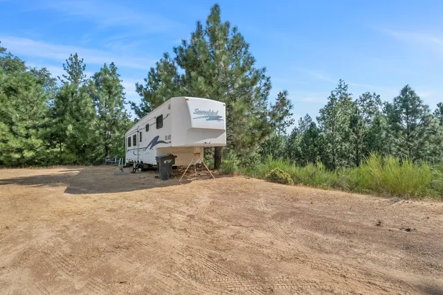 a picture of a road with a building in the background