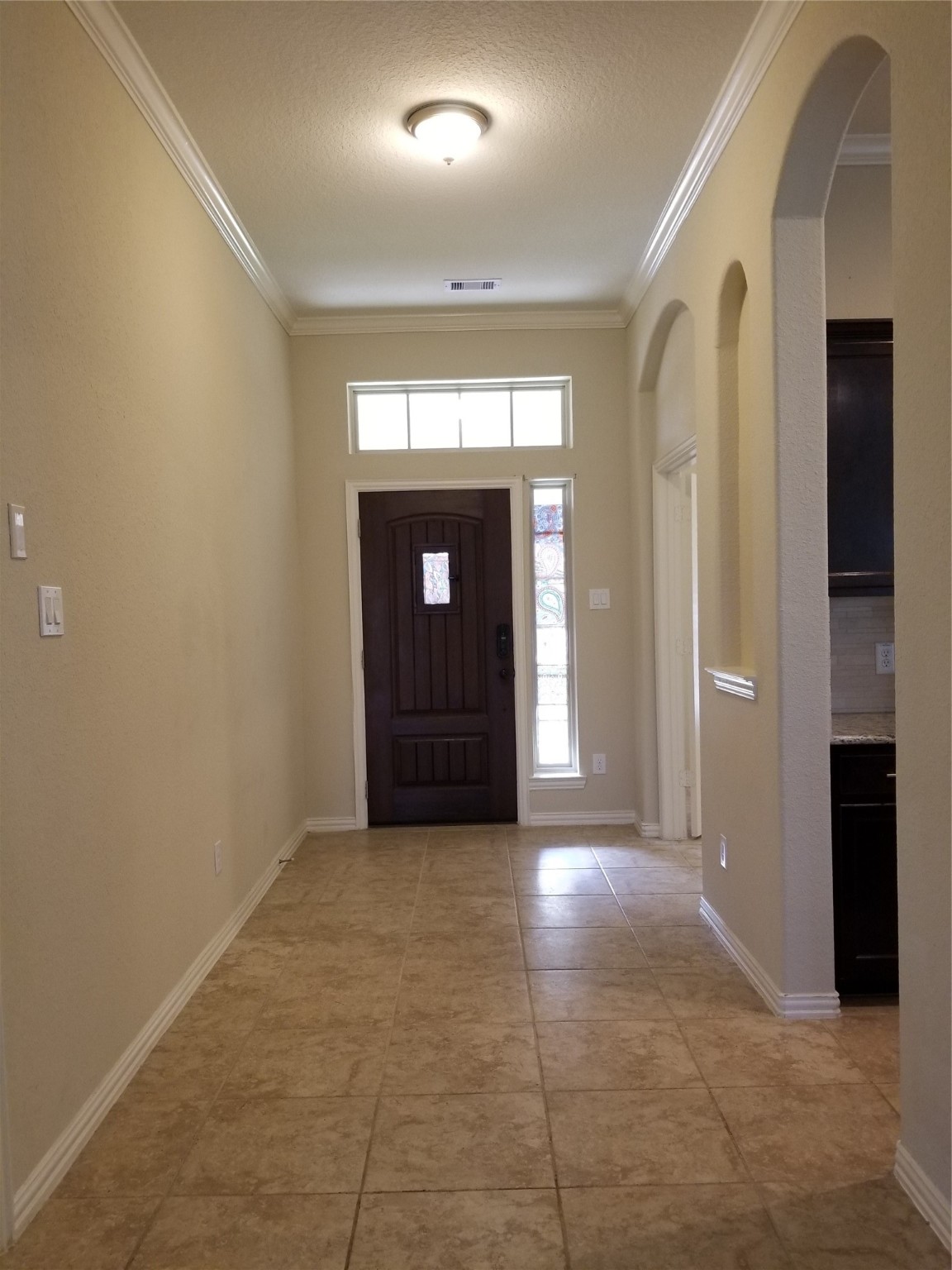 5217 Green Heath Lane Rosharon, TX 77583 - Photo 2 of 18 an empty room with windows and entrance