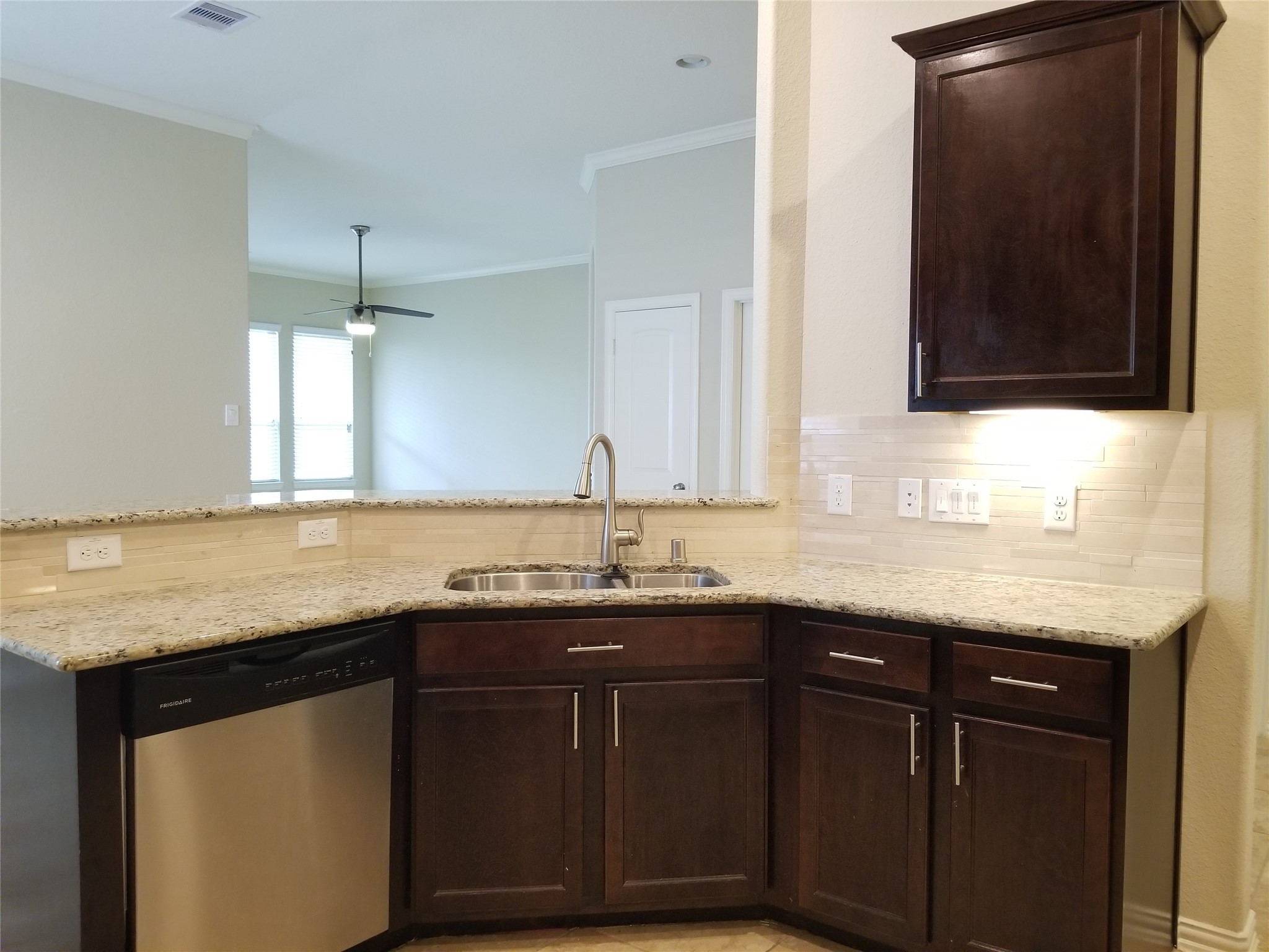 5217 Green Heath Lane Rosharon, TX 77583 - Photo 4 of 18 a kitchen with granite countertop a sink and cabinets