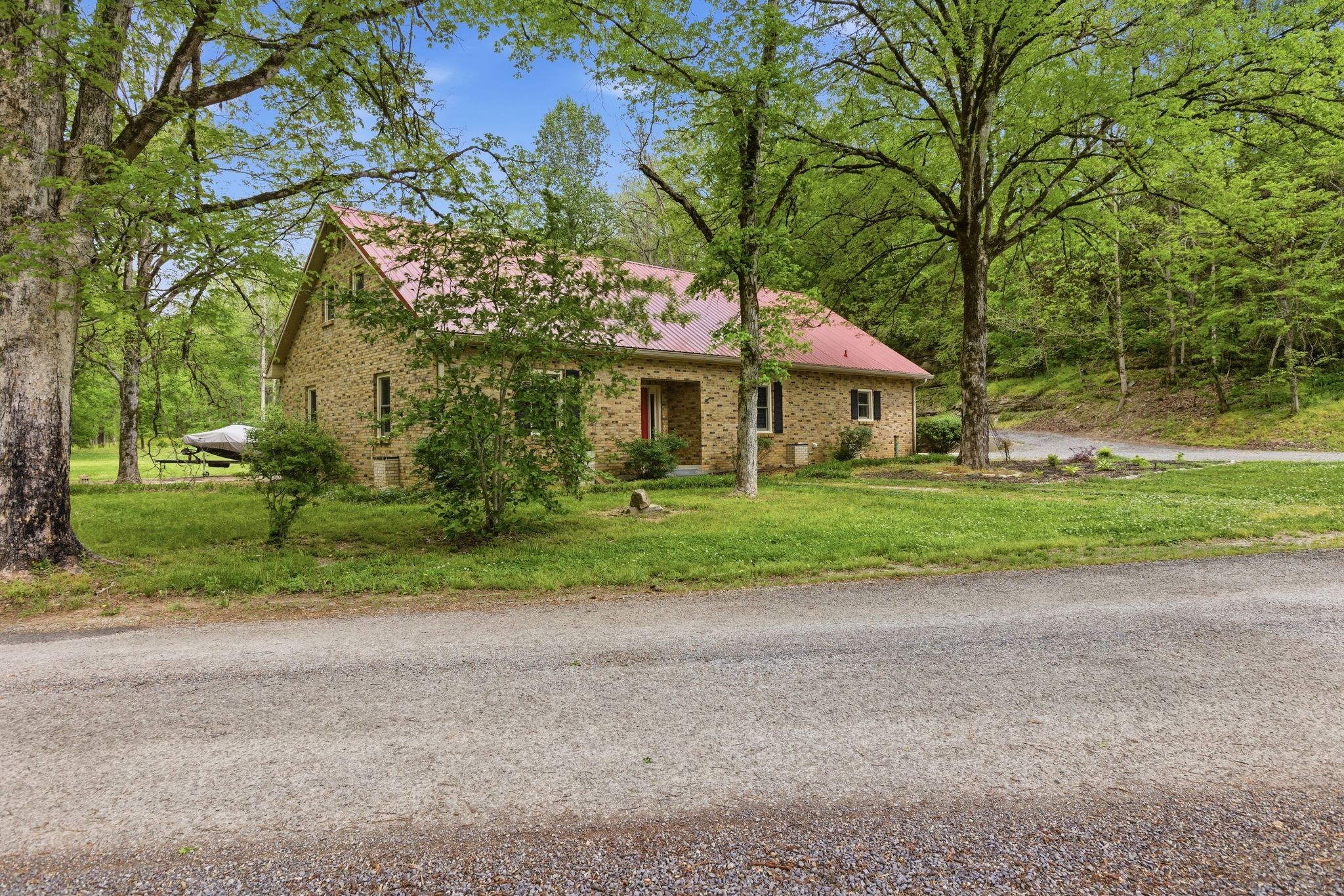 580 Defeated Creek Road Centerville, TN 37033 - Photo 2 of 71 a front view of a house with a yard and garage