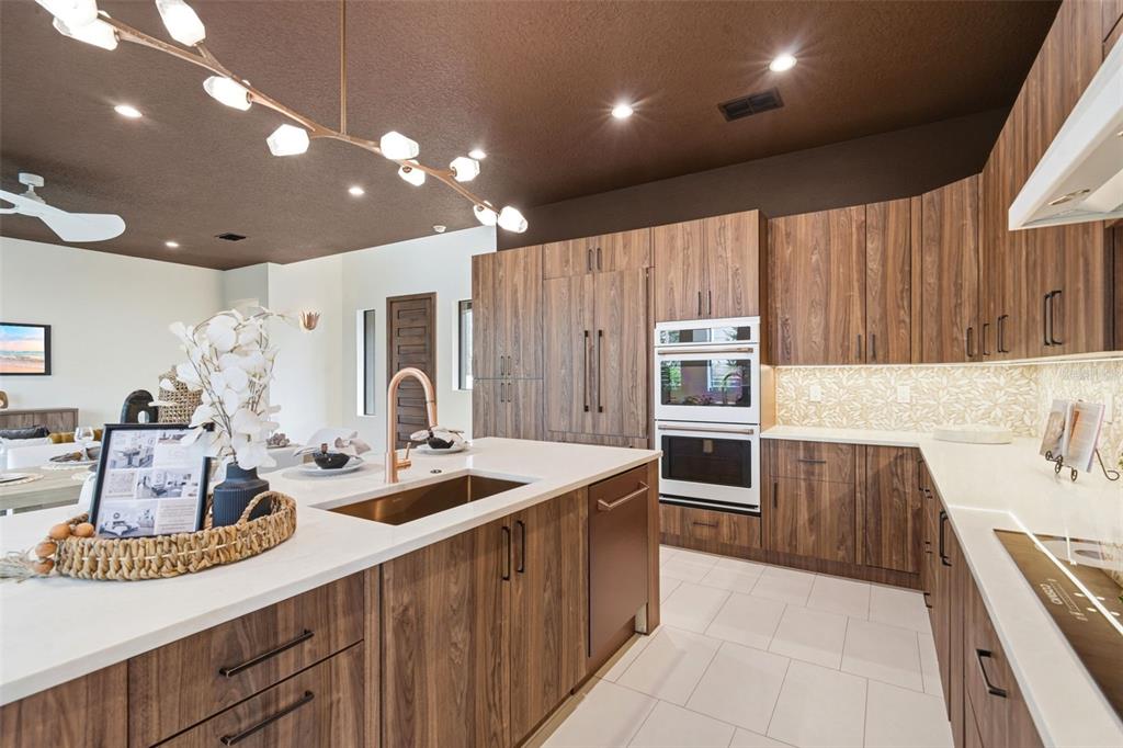 1615 Cole Road Orlando, FL 32803 - Photo 8 of 31 a kitchen with kitchen island a counter space a stove a sink and cabinets