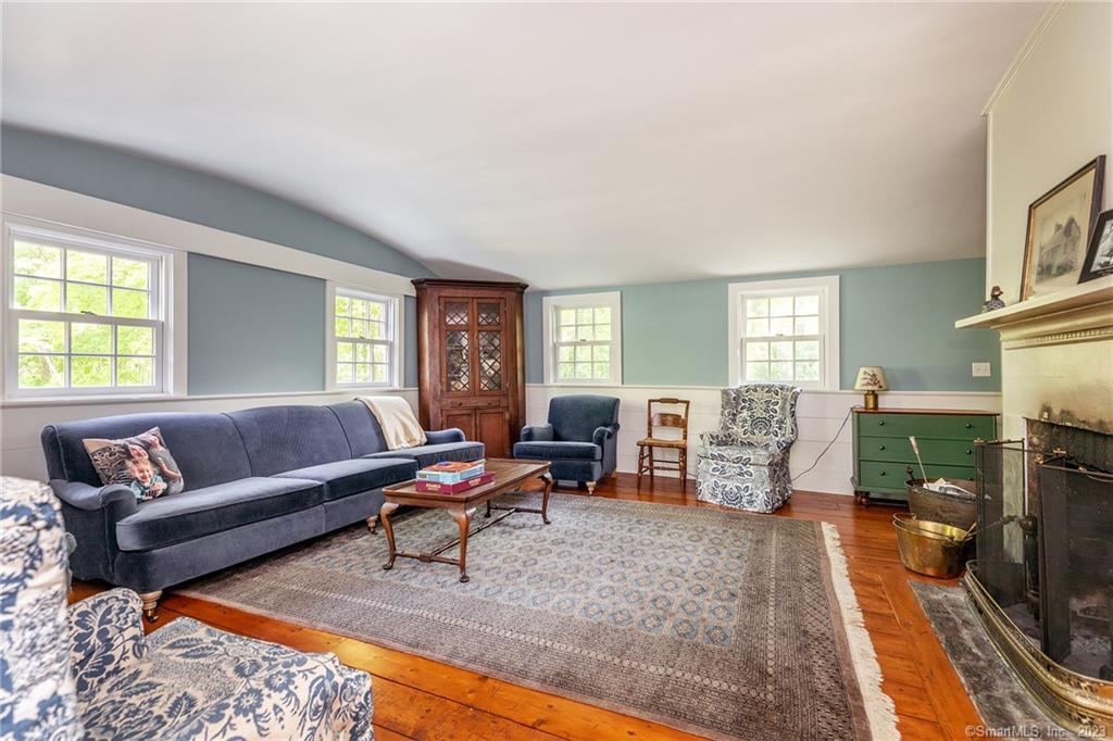 90 Sharon Mountain Road Sharon, CT 06069 - Photo 5 of 23 a living room with furniture and a fireplace