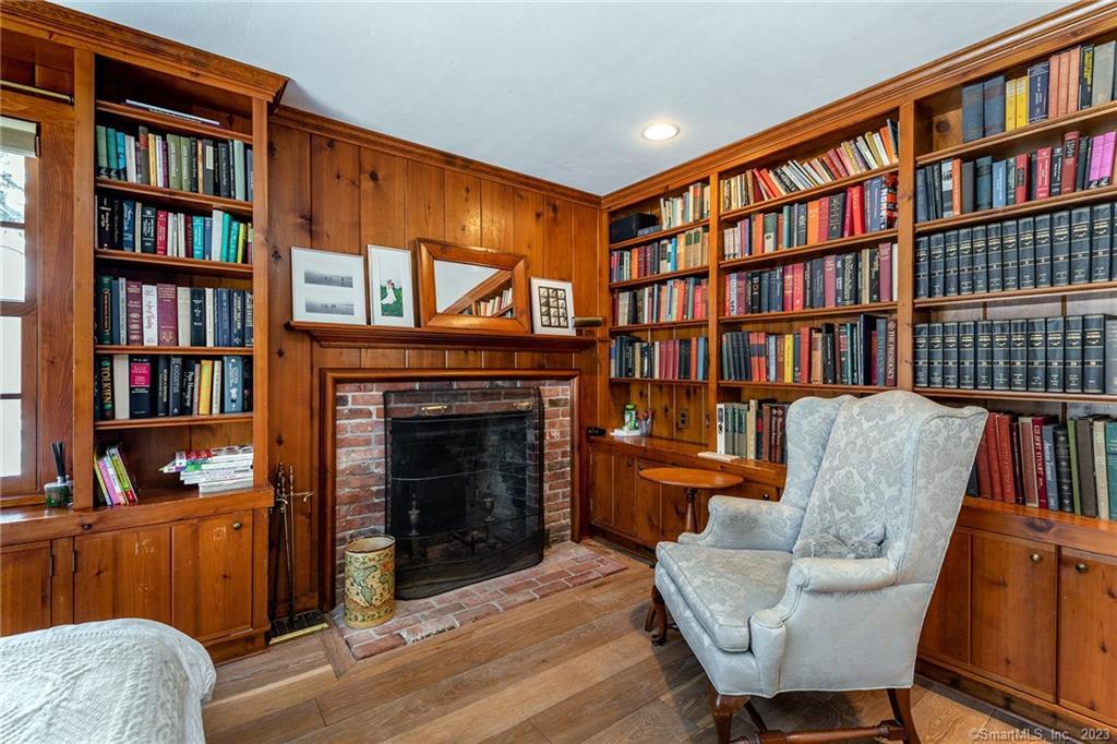 90 Sharon Mountain Road Sharon, CT 06069 - Photo 10 of 23 a living room with fireplace furniture and a book shelf
