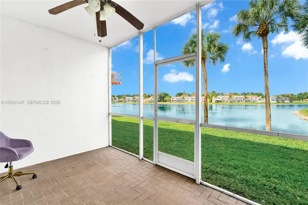 a view of an apartment with a backyard