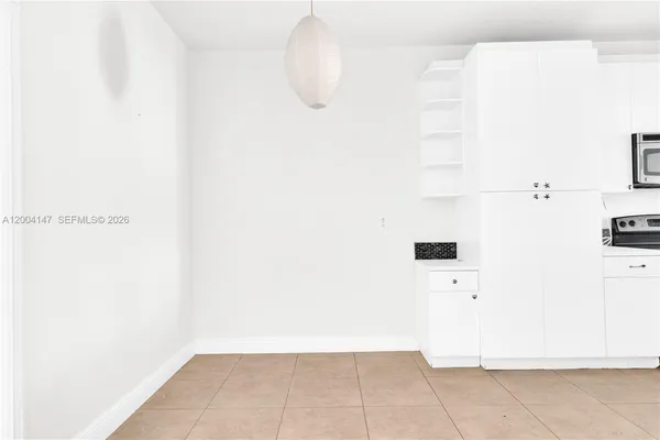 a view of kitchen and dining room with furniture