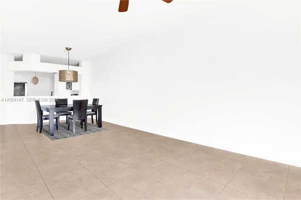 a kitchen with stainless steel appliances a refrigerator sink and stove