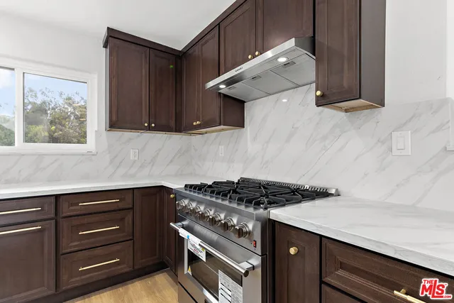 a kitchen with a stove and a cabinet