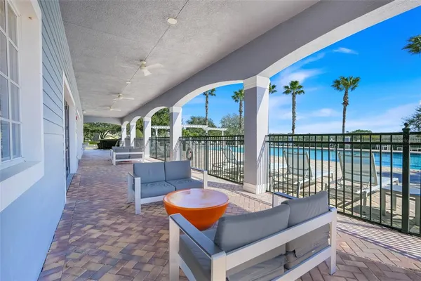 a view of a patio with a table and chairs