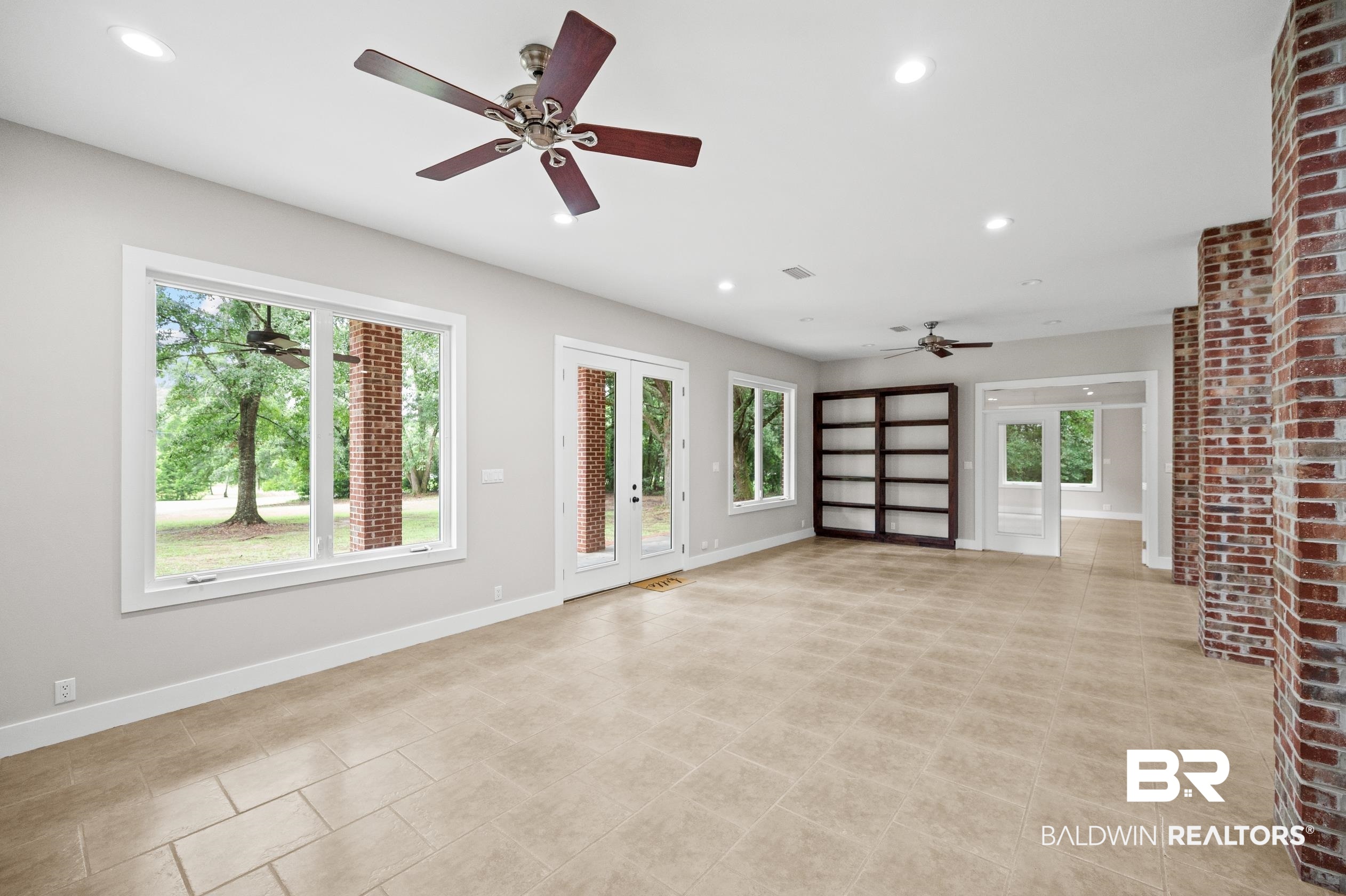 15031 Timber Ridge Drive Loxley, AL 36551 - Photo 17 of 43 Unfurnished living room with a wealth of natural light and ceiling fan
