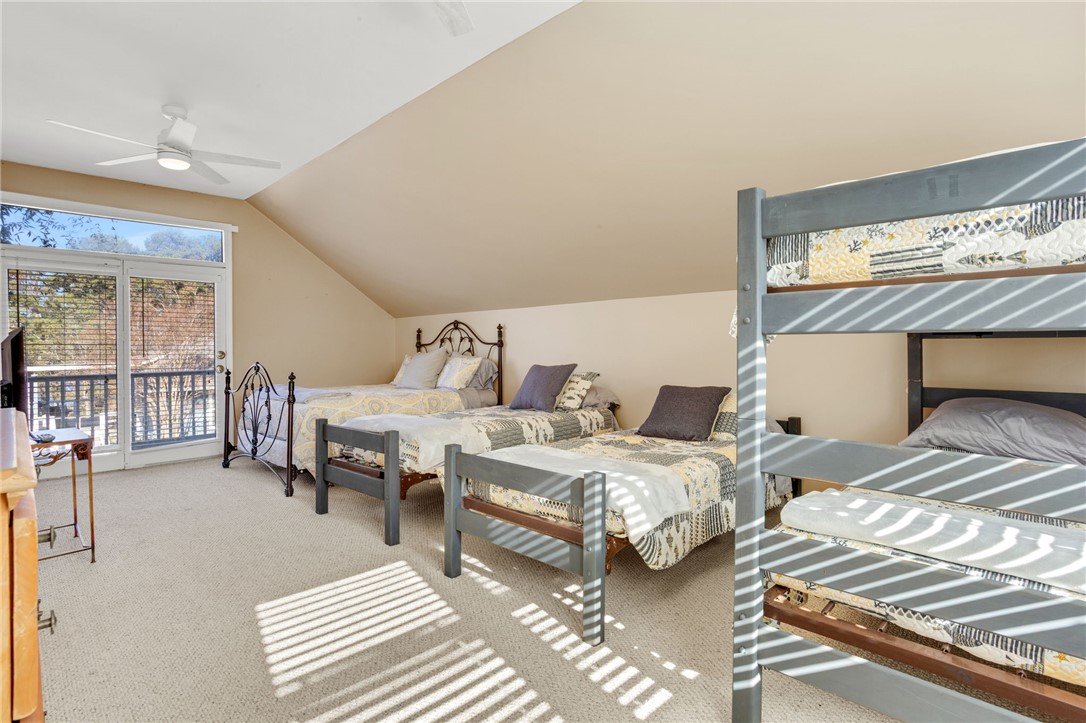1133 Elrod Ferry Road Hartwell, GA 30643 - Photo 36 of 46 This spacious bedroom offers ample sleeping arrangements and outdoor access for a versatile living experience.