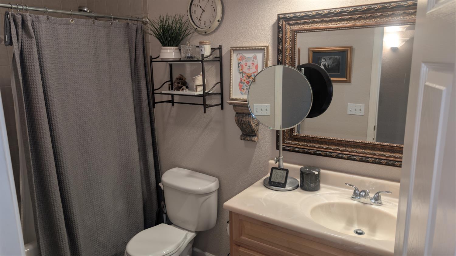 3248 Sudbury Road Cameron Park, CA 95682 - Photo 39 of 41 a bathroom with a sink toilet and mirror