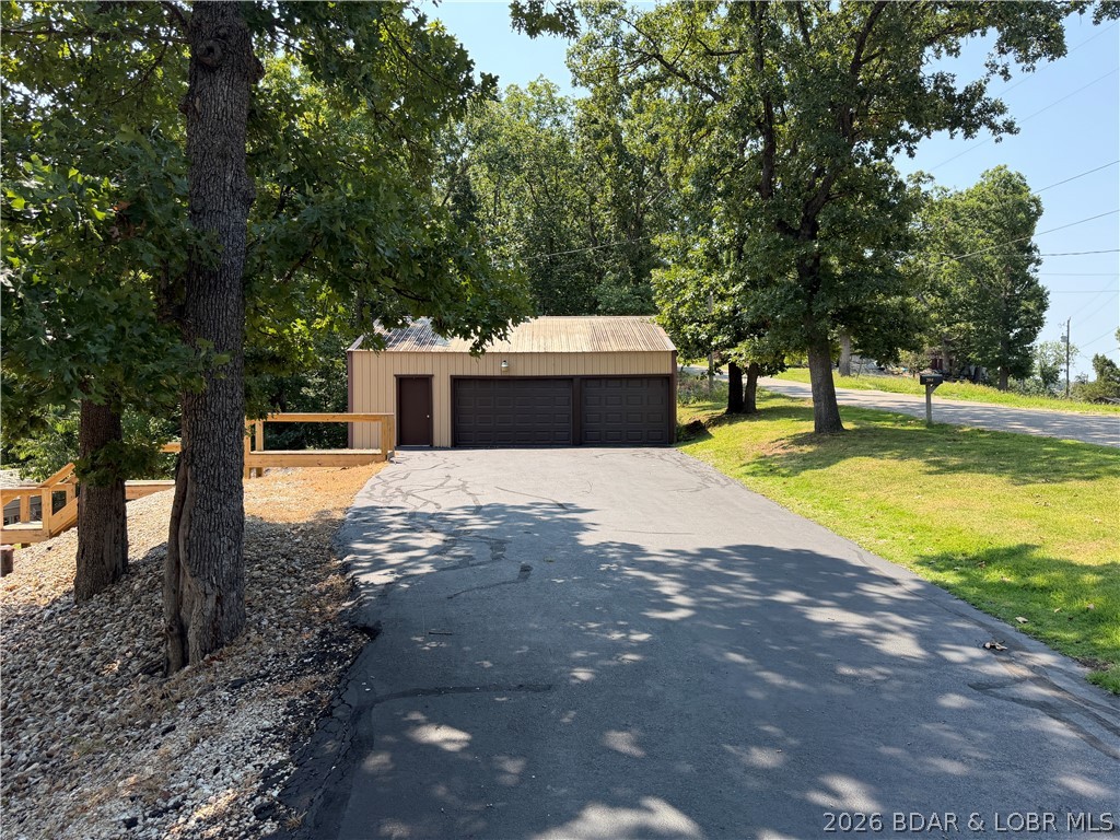 2084 Spring Cove Road Sunrise Beach, MO 65079 - Photo 55 of 63 2 car garage closest to road