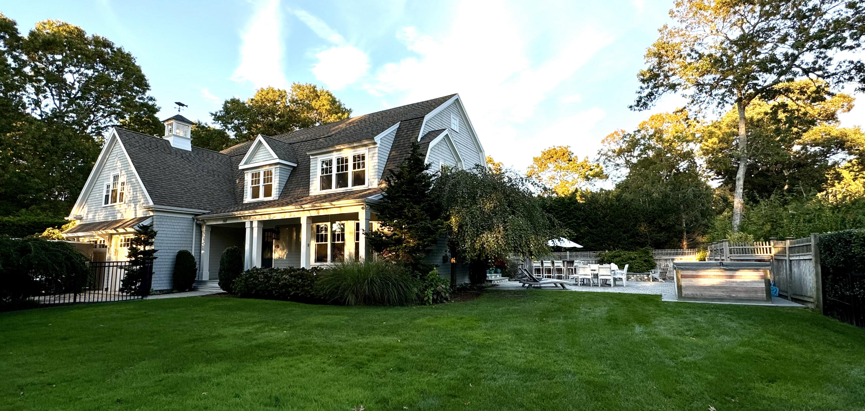 107 Summersea Road Mashpee, MA 02649 - Photo 2 of 29 a front view of a house with a garden and trees