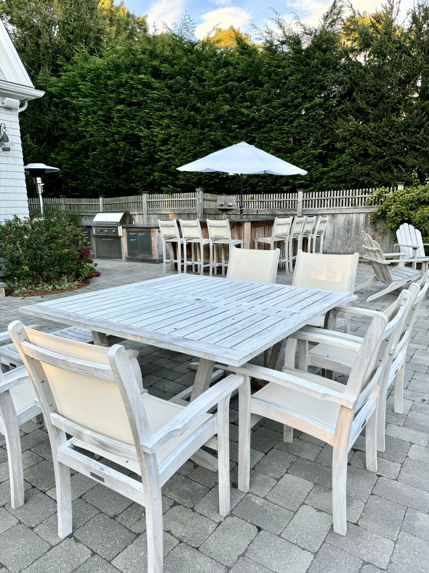 107 Summersea Road Mashpee, MA 02649 - Photo 23 of 29 a view of backyard of house with seating space barbeque oven and trees