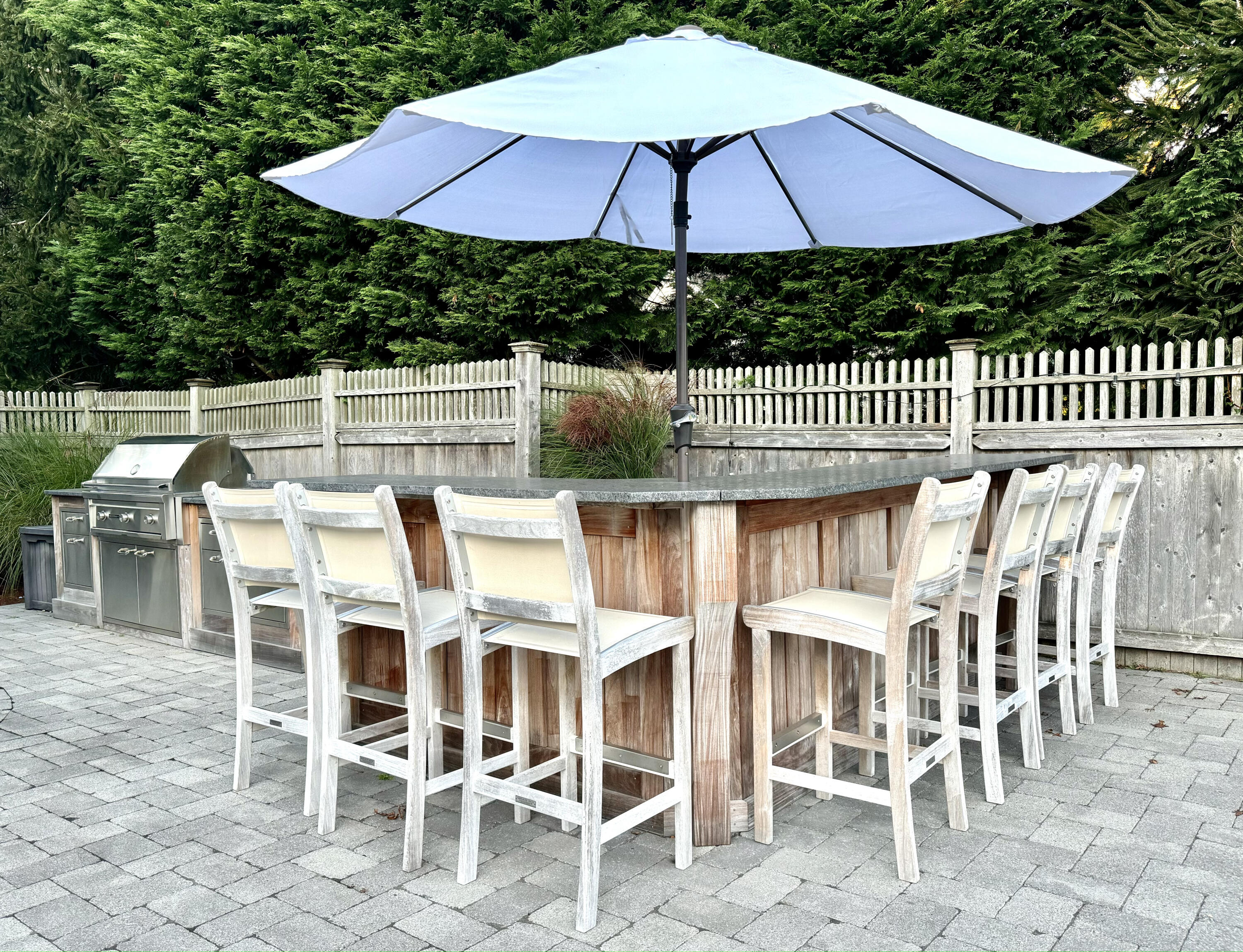 107 Summersea Road Mashpee, MA 02649 - Photo 26 of 29 a view of a chairs and table under an umbrella